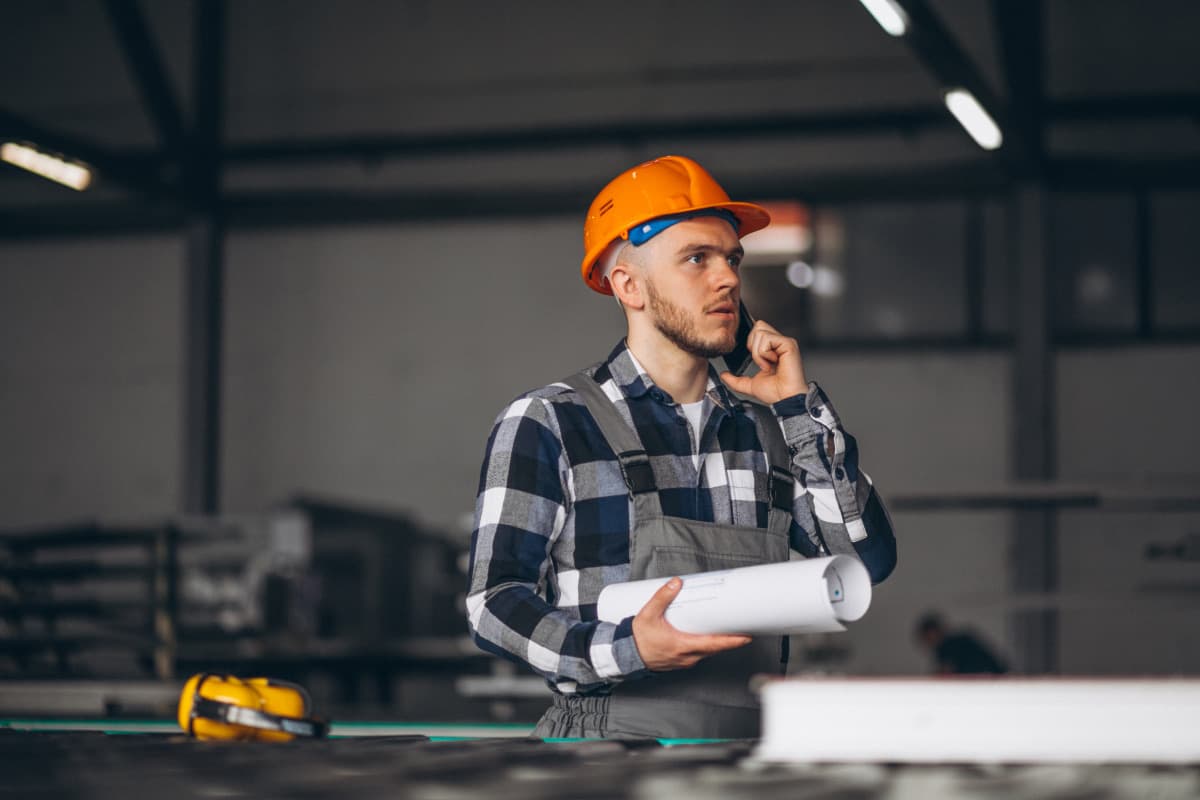 Factory specialist reviewing production plans