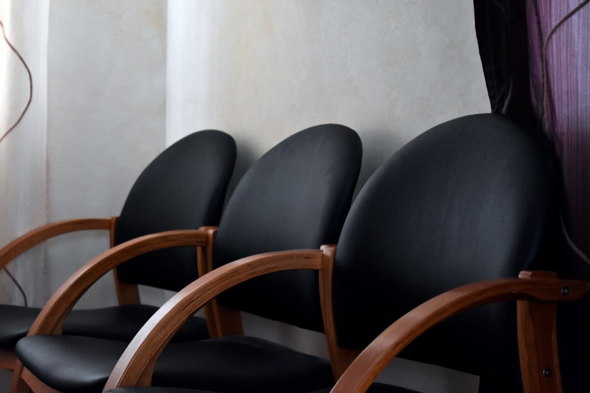 Three contemporary black office chairs