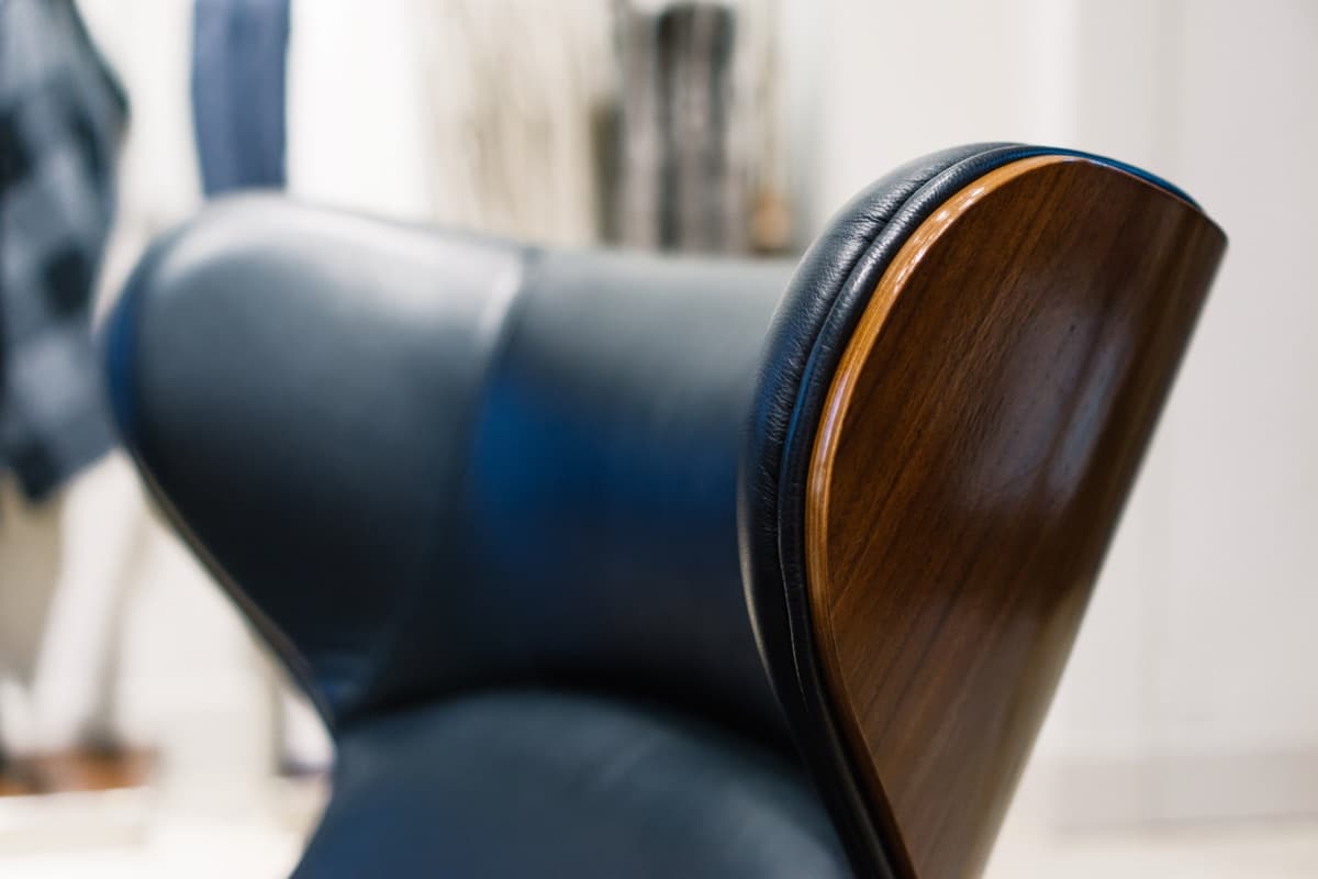 Close view of a black leather chair backrest