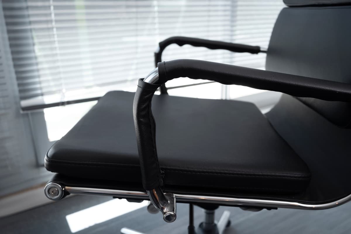 Black office chair mechanism viewed from the side